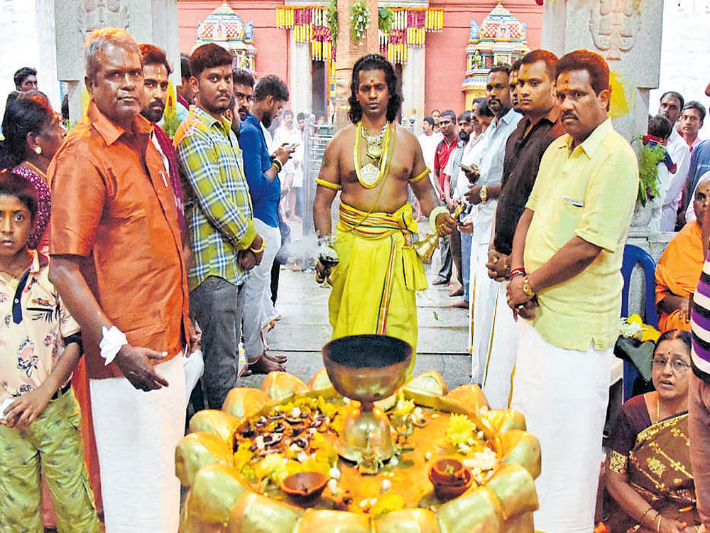 Jnanedra, who will be carrying the Karaga for the 7th year offers pooja at Dharmaraya Swamy temple premises in Bengaluru on Monday. DH photo