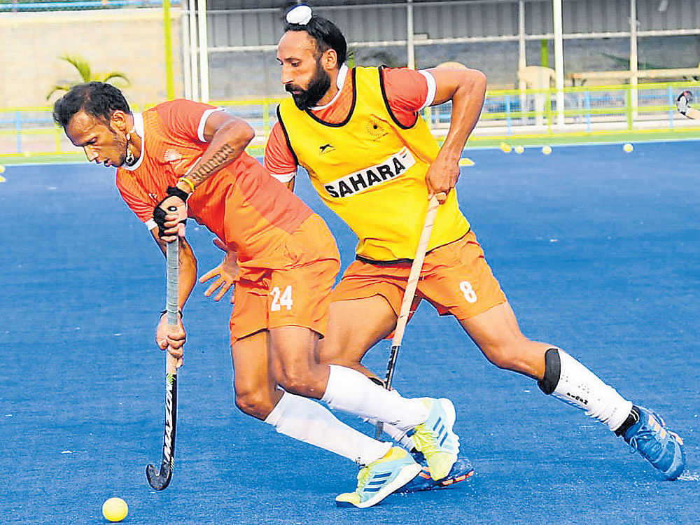 Still going strong S V Sunil (left) and Sardar&#8200;Singh during a training session at the SAI centre in Bengaluru on Tuesday. DH photo/ KISHOR KUMAR BOLAR