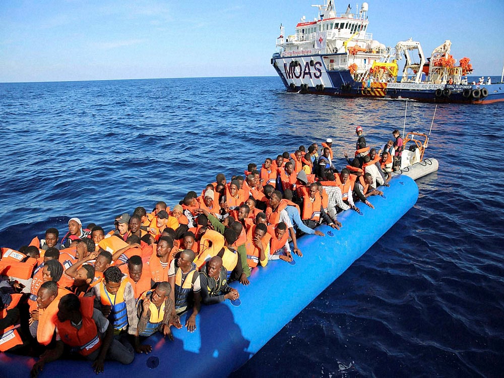 At least 97 migrants missing as boat sinks off Libya