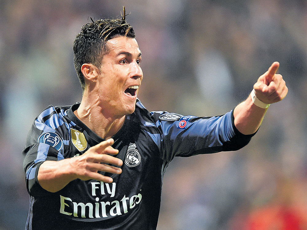talisman: Real Madrid's Cristiano Ronaldo celebrates after scoring against Bayern Munich on Wednesday. Reuters