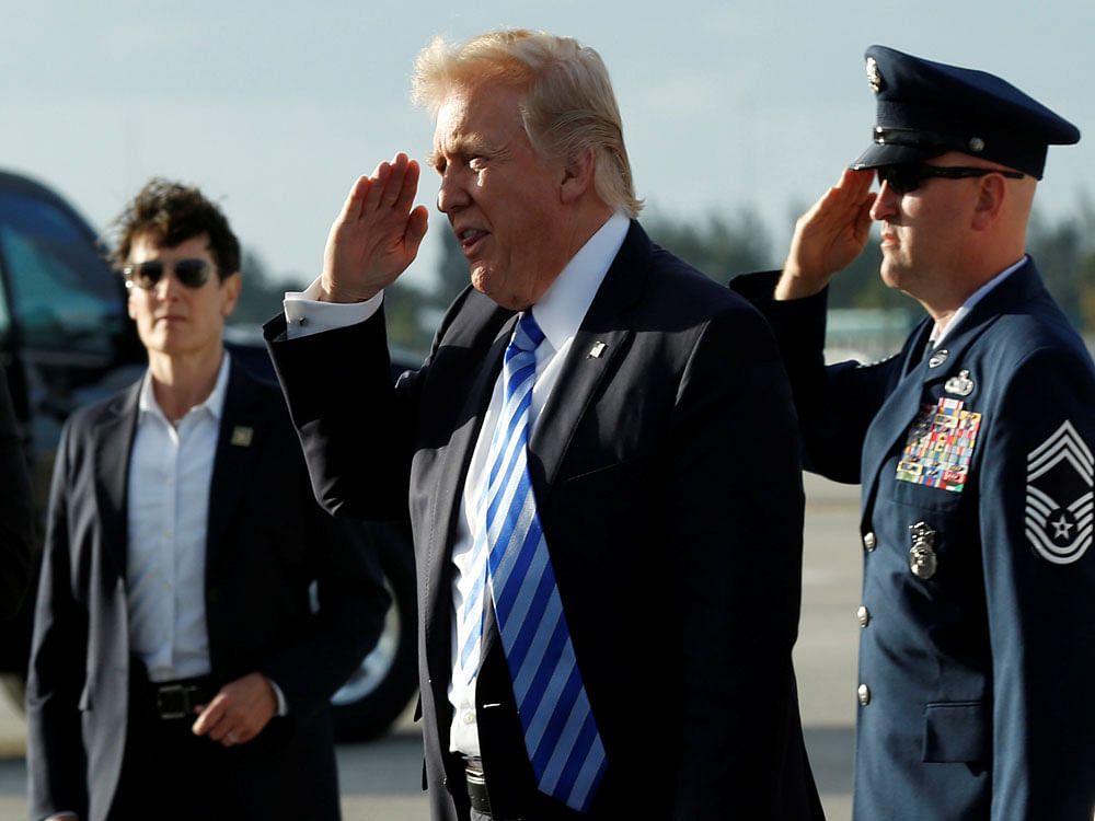 U.S. President Donald Trump salutes as he arrives at Palm Beach International Airport in West Palm Beach, Florida, for the Good Friday holiday and Easter weekend. Reuters photo