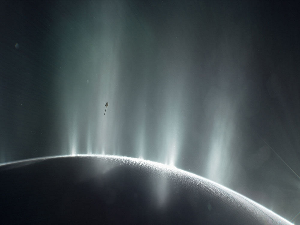 NASA's Cassini spacecraft is shown diving through the plume of Saturn's moon Enceladus. Reuters photo