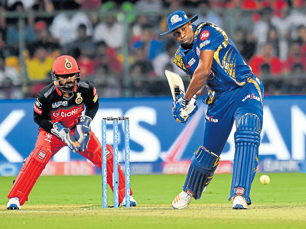giant stands tall: Mumbai Indians' Kieron Pollard prepares to launch one into the stands. dh photo/ srikanta sharma r
