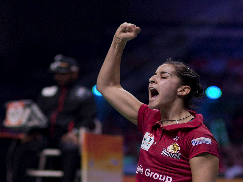 Overjoyed Spain's Carolina Marin exults after beating India's PV Sindhu in the quarterfinal of the Singapore Open. PTI File photo