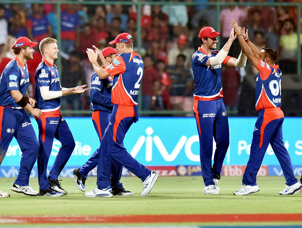 Delhi Daredevils players celebrate after dismissal of G Maxwell of KXIP during an IPL match between Delhi Daredevils and Kings XI Punjab at Ferozshah Kotla in New Delhi on Saturday. PTI Photo