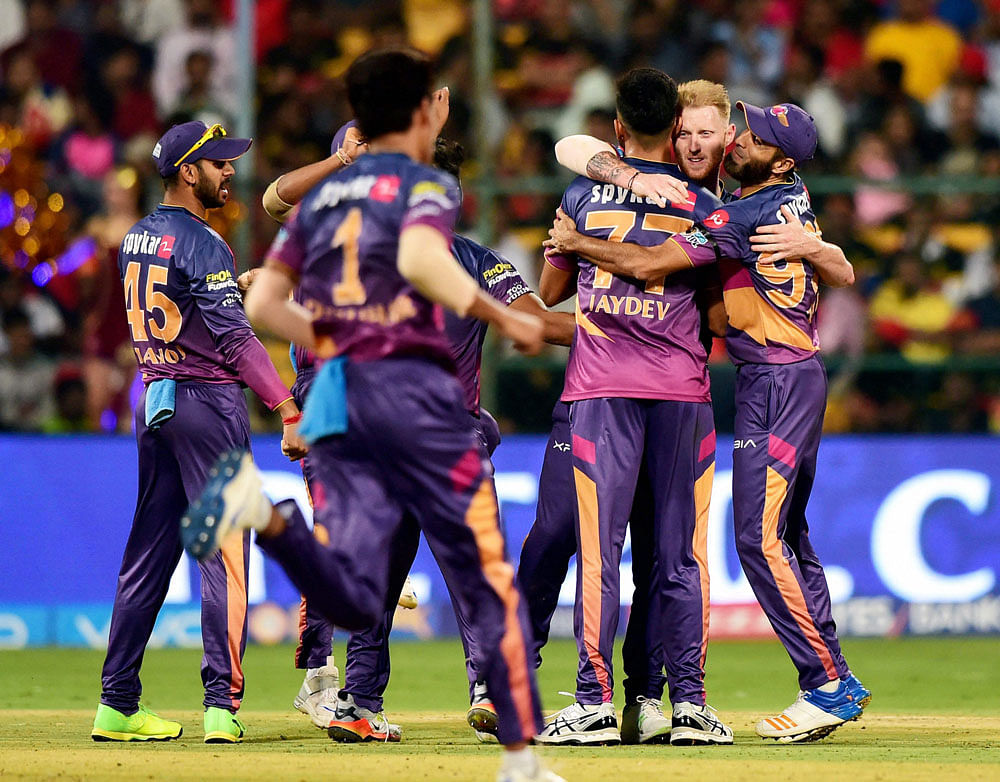 Rising Pune Supergiants Ben Stokes with team mates celebrate the wicket of Shane Watson during the match between Royal Challengers Bangalore and Rising Pune Supergaints at Chinnaswamy Stadium in Bengaluru on Sunday. PTI Photo