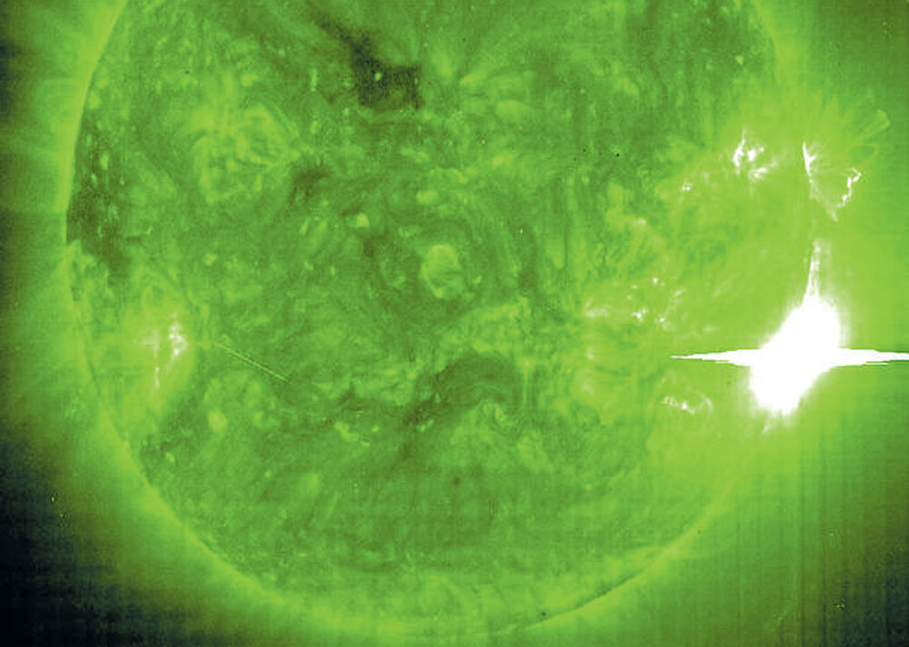 The sun's ghostly glow highlights spots in its atmosphere where material simmers at 1.5 million kelvin. PHOTO CREDIT: NASA