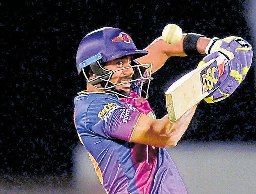 Manoj Tiwary played a crucial knock against RCB in Bengaluru.