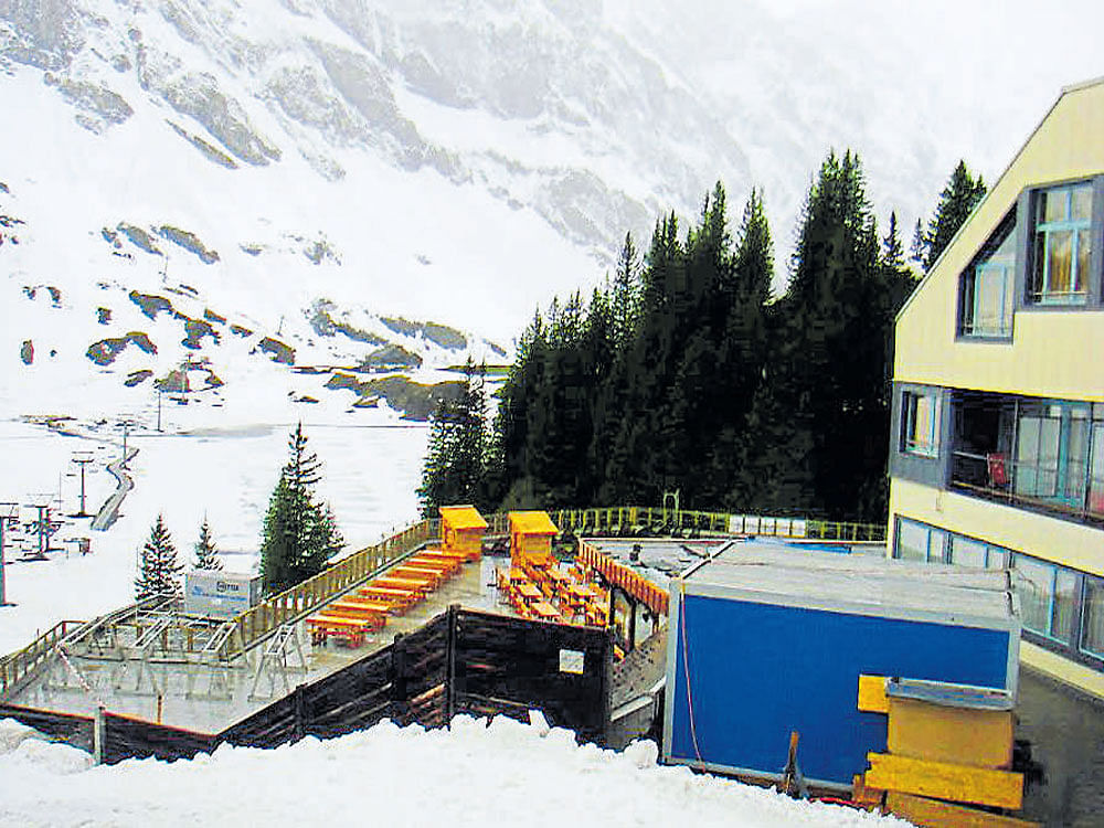 picturesque Deserted decks with cafes on the slopes of Mount Titlis due to snowfall.