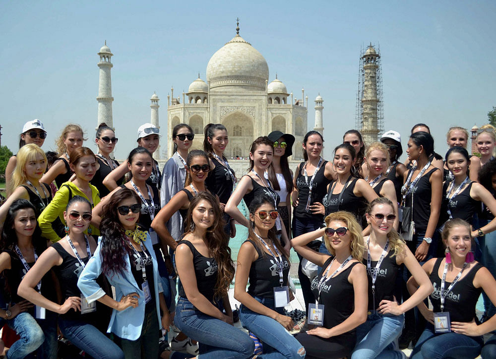 Super models from various countries pose at the Taj Mahal in Agra on Wednesday. PTI