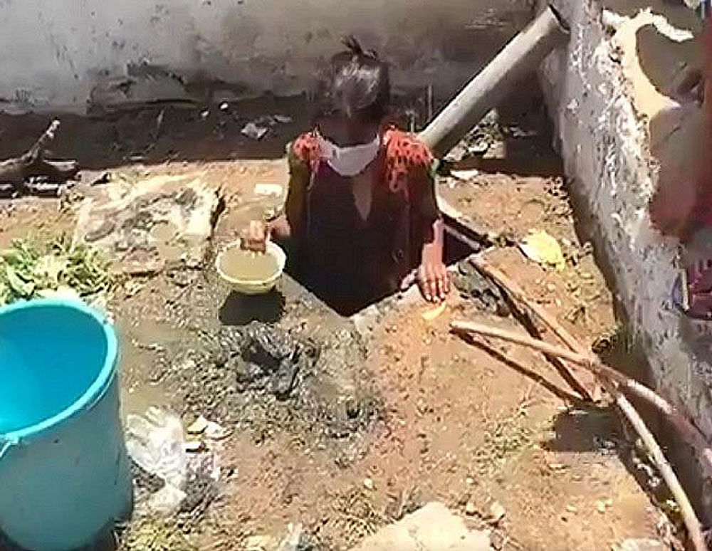 A HIV infected orphanage girl cleaning man hole.