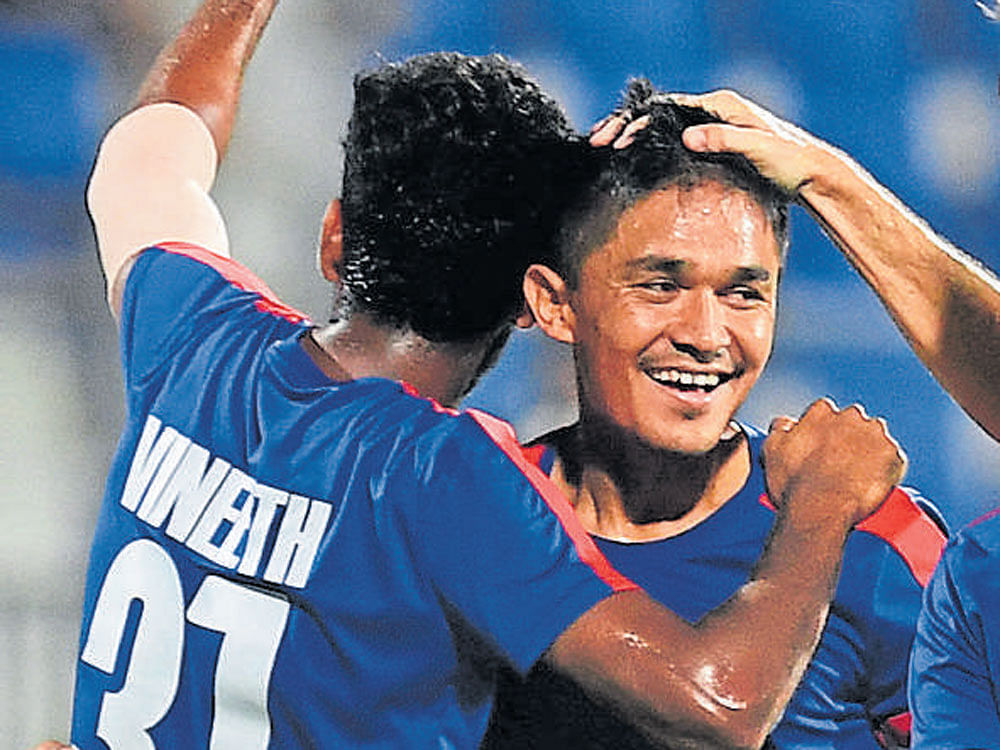 brilliant effort: Bengaluru FC skipper Sunil Chhetri (right) celebrates with team-mate CK Vineeth after scoring against DSK Shivajians. dh photo/kishor kumar bolar