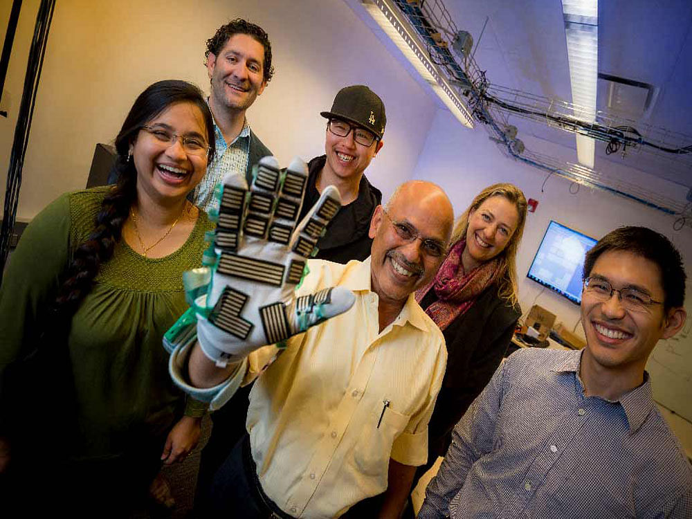 Harinath Garudadri and his team, with the spasticity-measuring glove. Photo Credit:UC San Diego