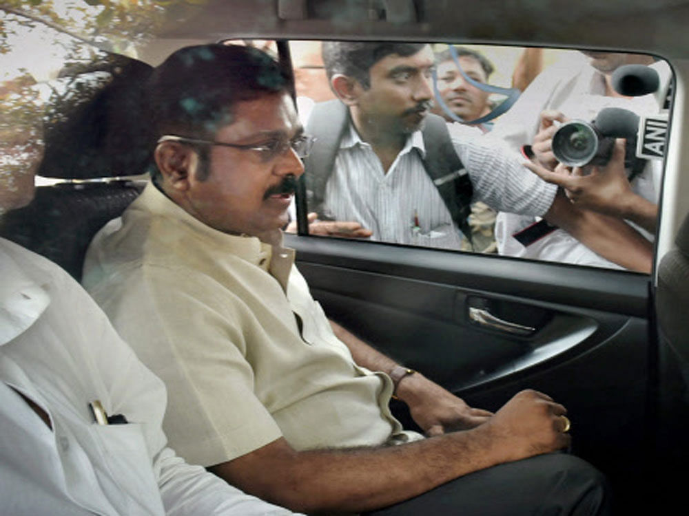 AIADMK leader TTV Dinakaran arriving to appear before Delhi police for questioning in connection with an alleged attempt to bribe an EC official for retaining the two leaves party symbol, at the Crime Branch office at Chanakyapuri in New Delhi on Saturday. PTI Photo