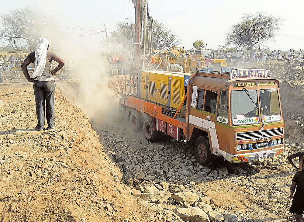 Borewell-digging machines being used to drill holes to loosen the rocky terrain as part of the rescue operation. DH photo