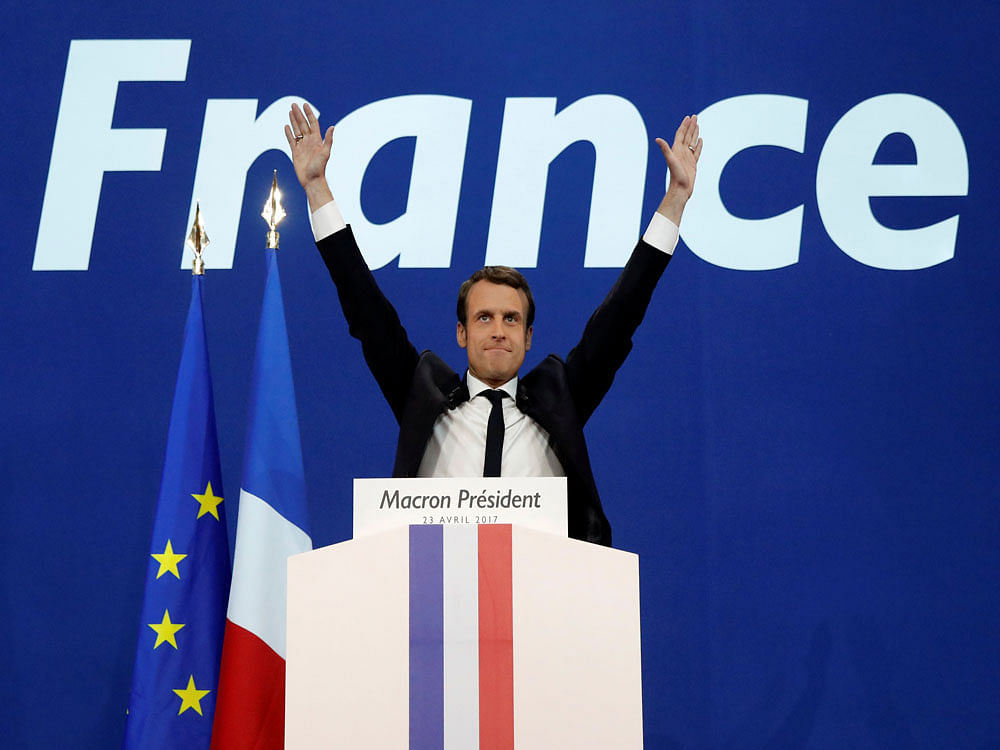 Macron, head of the political movement En Marche, or Onwards, and candidate for the 2017 French presidential election, celebrates after partial results in the first round of 2017 French presidential election, in Paris. Reuters photo