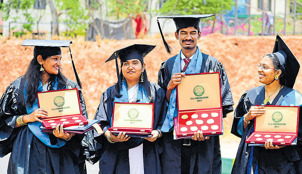 Gold medalists Archana, Preethi C, Raghuveer M and Arathi pose with medals during the 51st Convocation of University of Agricultural Sciences in Bengaluru on Monday. dh photo