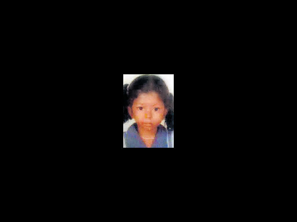 The decomposed body of the Harshitha who was missing for the last four days, was found in a carton in her neighbour's house on Sunday