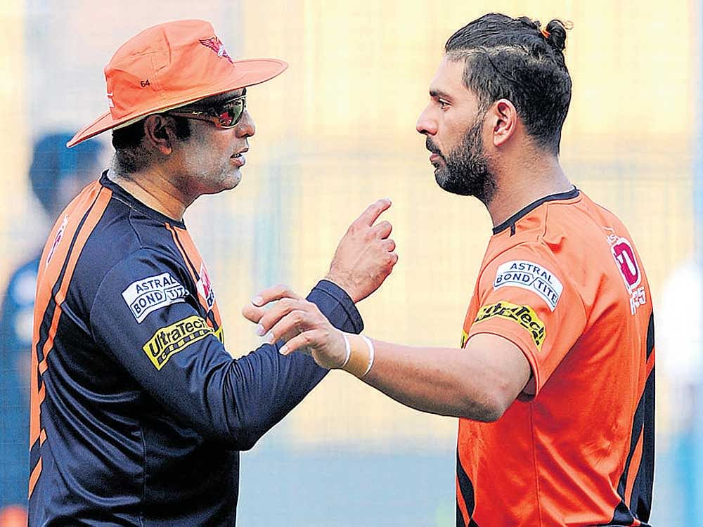 making a point Sunrisers' mentor VVS Laxman (left) and star batsman Yuvraj Singh in a discussion during their practice session in Bengaluru on Monday. DH photo/ srikanta sharma r