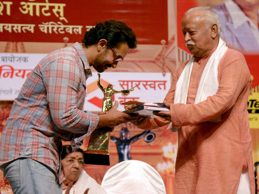 RSS Chief Mohan Bhagwat present award to Actor Aamir Khan during the Dinanath Mangeshkar 75th death anniversary in Mumbai on Monday. PTI Photo