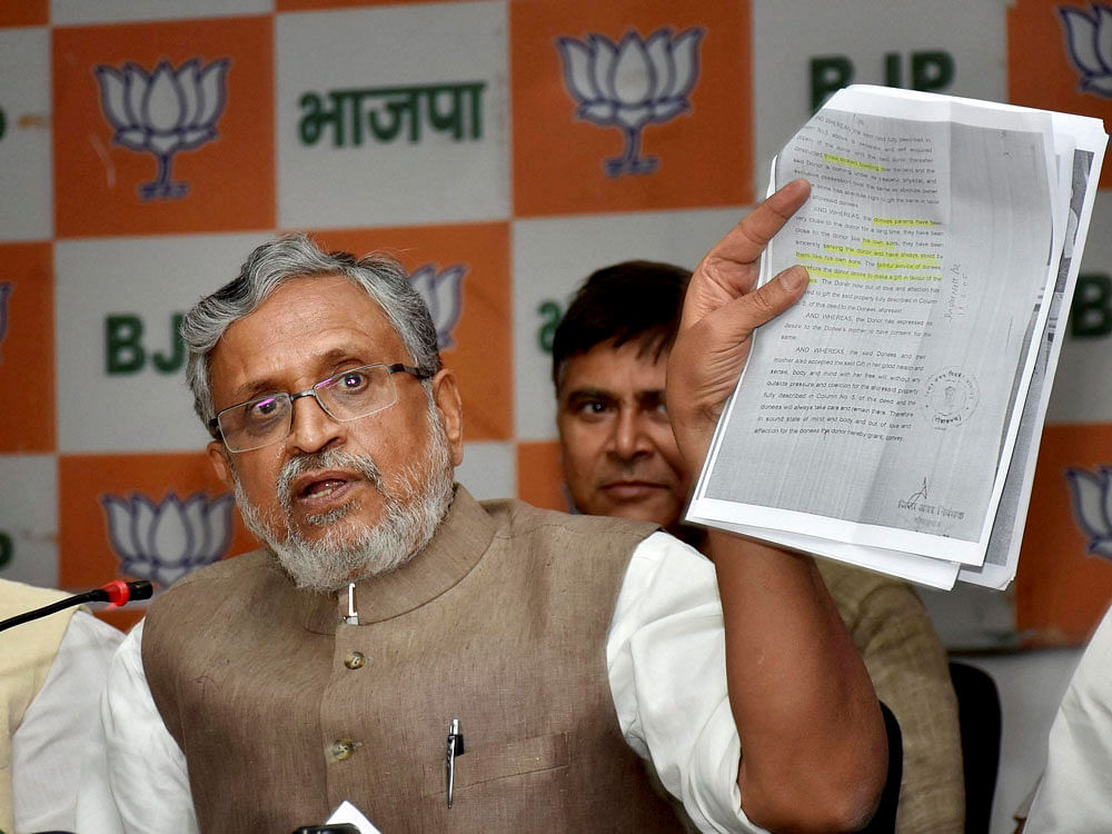 Substantiating his claim with documentary evidence, Modi said Kanti Singh, who was Union Minister of State for HRD in the Manmohan Singh Government, gave her land (around one acre) to Lalu's wife Rabri Devi on March 13, 2006. This deal, Modi said, was executed to ensure that Kanti continued as a Union Minister. PTI photo
