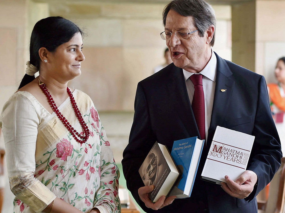 President of Cyprus Nicos Anastasiades being presented a book after paying tribute at Mahatma Gandhi's  memorial Rajghat in New Delhi on Friday. PTI