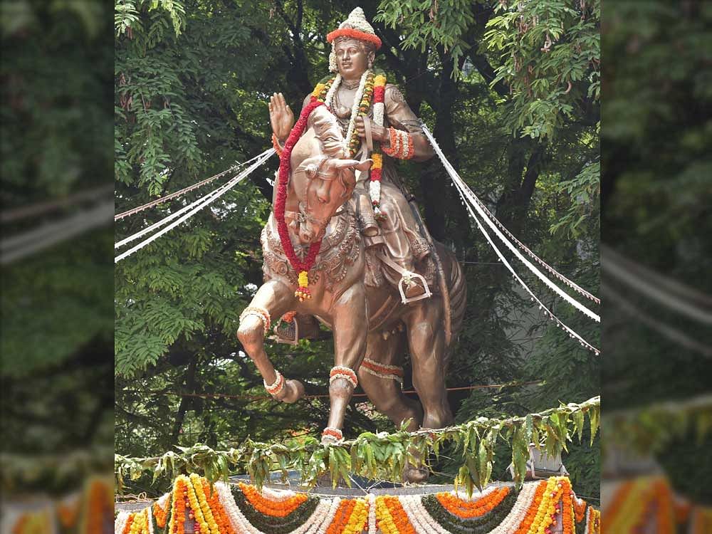 Basaveshwara statue is decorated on the occasion of Basava Jayanthi and Akshaya Tritiya at Basaveshwara Circle (Chalukya Circel) in Bengaluru on Saturday. DH Photo by S K Dinesh