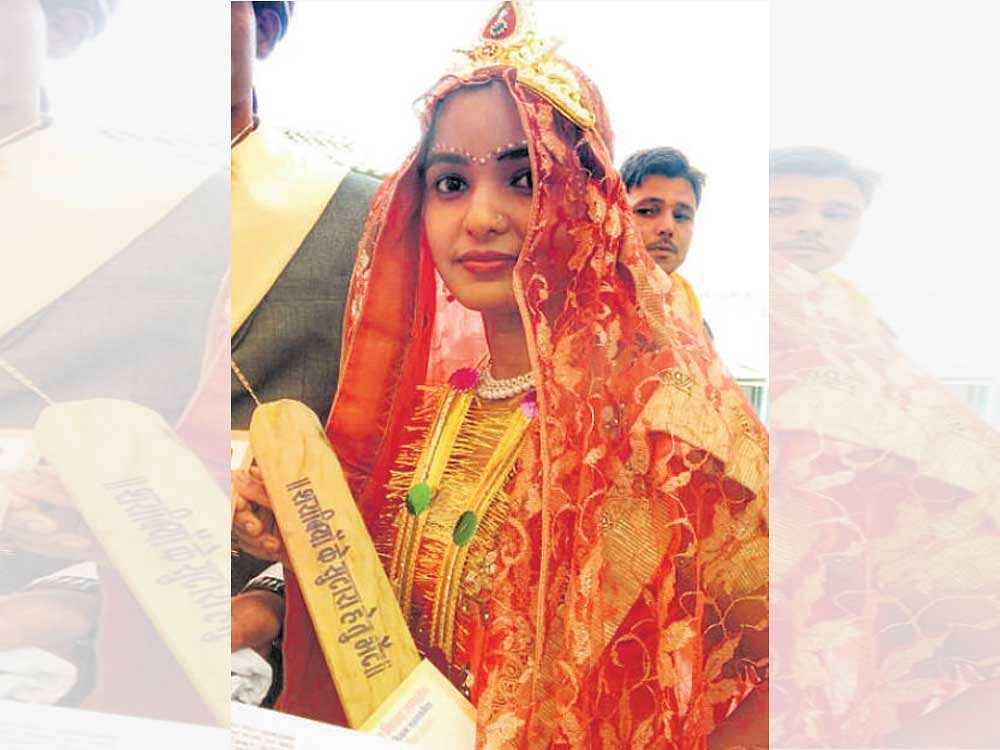A bride with the bat gifted by an MP minister. Facebook