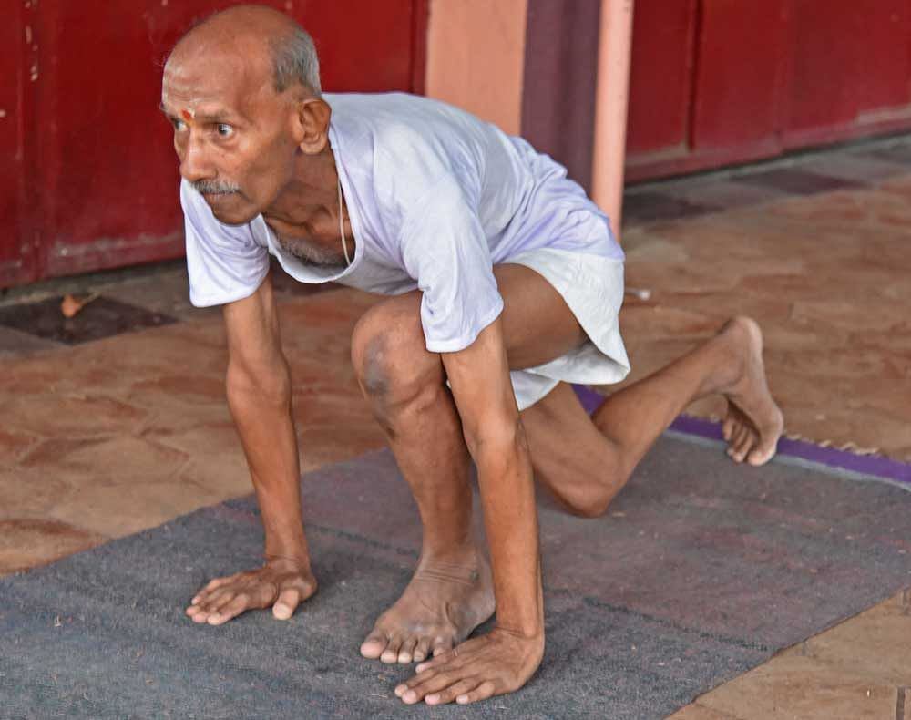 T&#8200;N&#8200;Shivakumar performs Surya Namaskars at the Kidwai Memorial Institute of Oncology on Sunday. DH&#8200;Photo