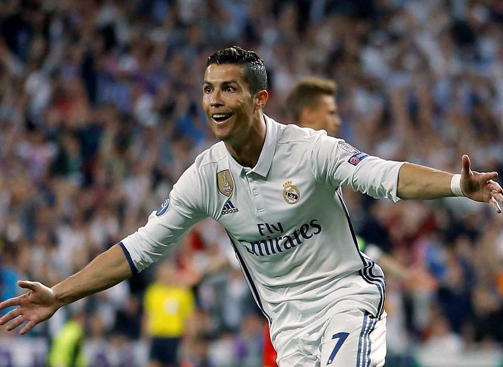 In this Tuesday, April 18, 2017 file photo, Real Madrid's Cristiano Ronaldo celebrates scoring during the Champions League quarterfinal second leg soccer match between Real Madrid and Bayern Munich at Santiago Bernabeu stadium in Madrid, Spain. The Champions League semifinals begin this week with Spanish rivals Real Madrid and Atletico Madrid meeting for the fourth consecutive time in the European competition, while surprising French club Monaco will try to keep Italian champion Juventus from returning to the final for the second time in three seasons. AP/PTI