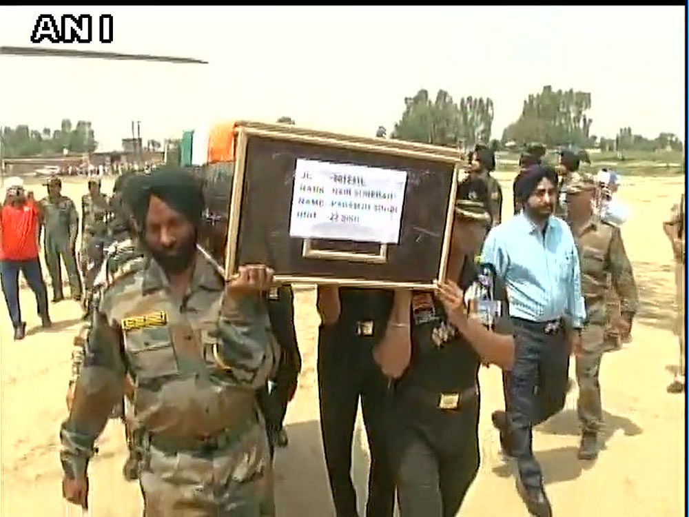 The body of Paramjeet Singh was brough to his hometown, and was given full military honour during the cremation. Photo credit: ANI.