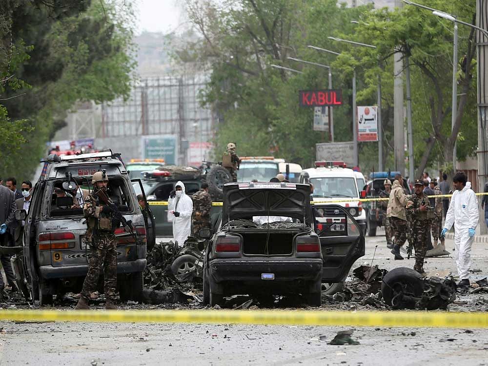 Security forces inspect the site of a suicide attack in Kabul, Afghanistan, Wednesday, May 3 , 2017. Najib Danish, deputy spokesman for the Interior Ministry, said Wednesday the target of the bomber was a convoy of foreign forces. AP/PTI