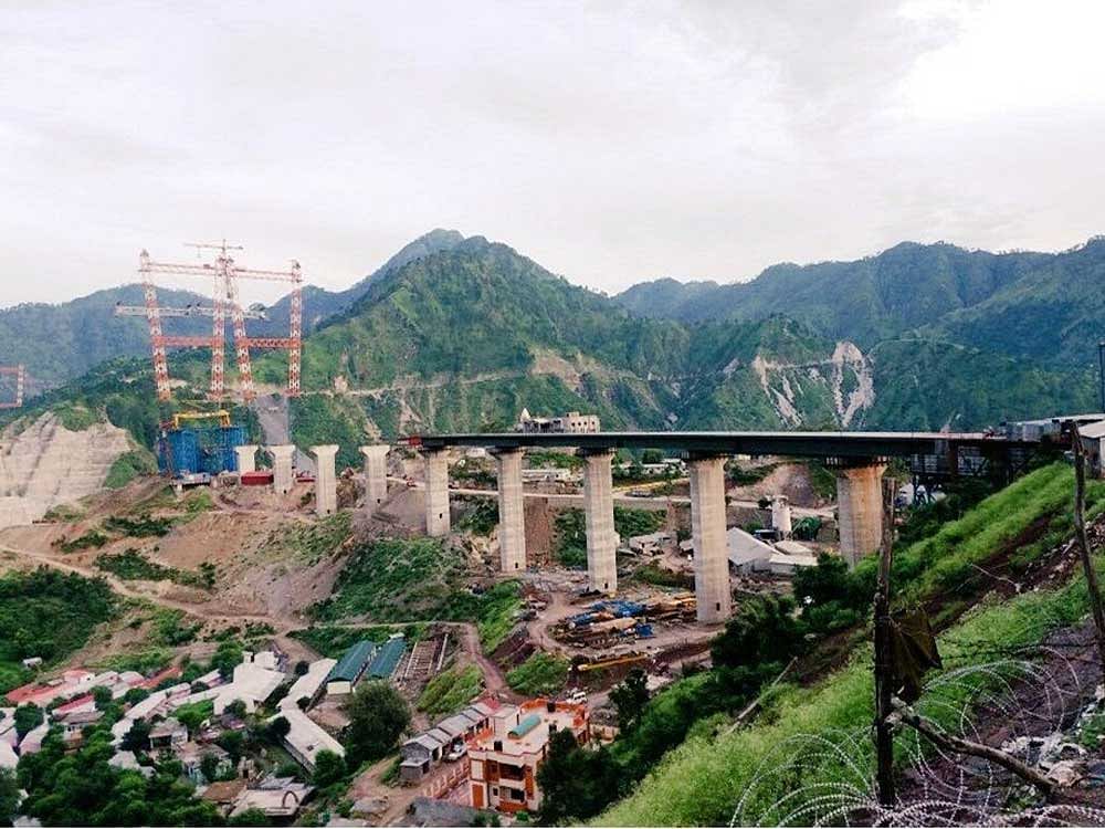 The massive arch-shaped structure, being constructed at a cost of around Rs 1,100 crore in hostile terrain, will use over 24,000 tonnes of steel and will rise 359 m above the river bed. Picture courtesy Twitter