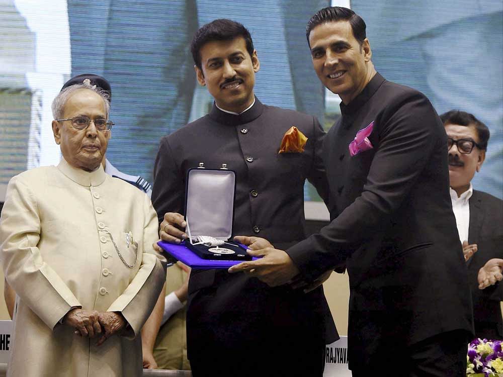 Actor Akshay Kumar poses for photographs after receiving Best Actor award from President Pranab Mukherjee at the 64th National Film Awards function in New Delhi on Wednesday. PTI Photo