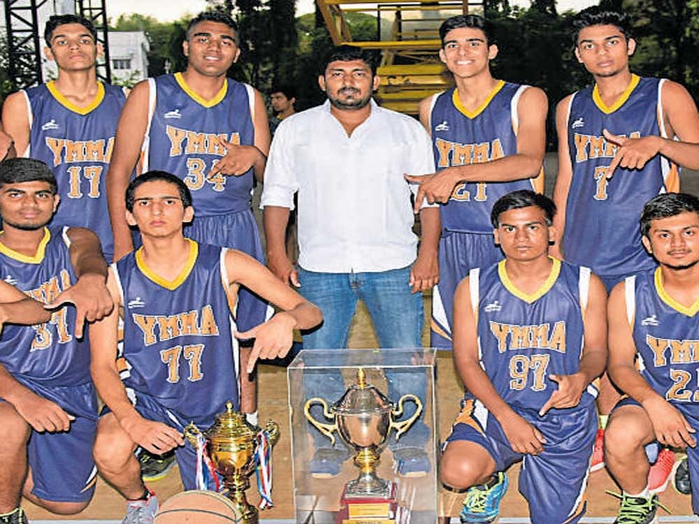 YMMA, winners of the state junior boys' basketball championship. From left (Standing): Prathyanshu, Pramod, Priyanshu, Sunny (coach), Prabhat T, Vishaal, Sai Prakash. (Kneeling): Mukul, Sai Shrey, Prashanth, Shiva, Milan, Sachin. DH Photo