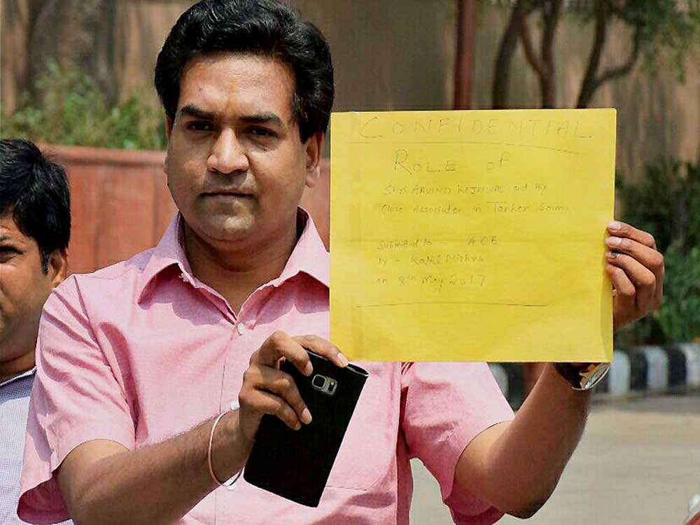 Sacked Delhi Water Minister Kapil Mishra arrives at ACB office to submit evidence in the alleged water tanker scam case to the Anti-Corruption Bureau, in New Delhi on Monday. Press Trust of India photo