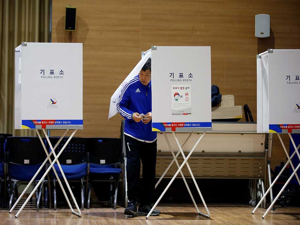 A man prepares to cast his vote at a polling station during the presidential elections in Seoul. Reuters photo