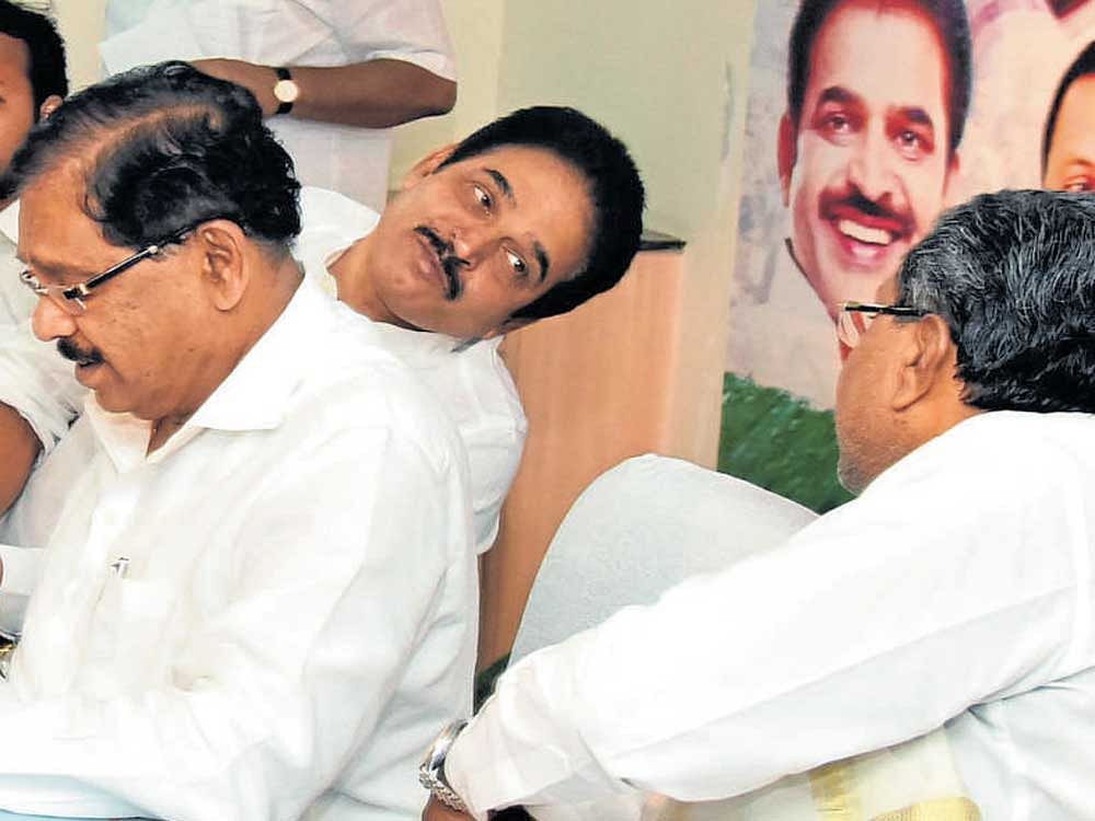 K C Venugopal, AICC general secretary in charge of Karnataka, shares a word with Chief Minister Siddaramaiah at the KPCC coordination committee meeting in Bengaluru on Wednesday. KPCC president G&#8200;Parameshwara and others  are seen. DH photo