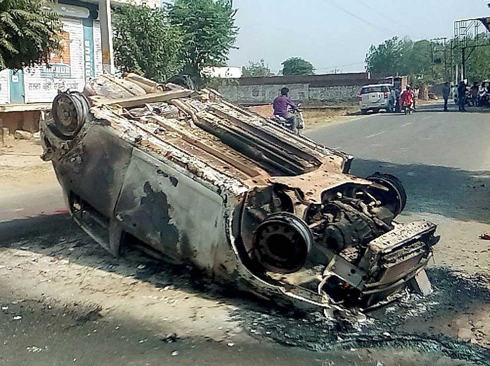 A damaged car after a clash in Saharanpur on Tuesday. PTI file Photo