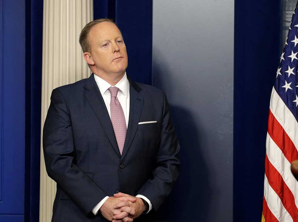 White House spokesman Sean Spicer stands by the lectern before holding his press briefing at the White House in Washington, U.S., May 12, 2017. REUTERS