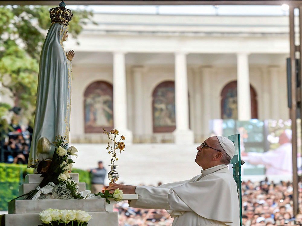 Pope Francis offers the 'Golden Rose', recognition at the Sanctuary of Our Lady of Fatima Friday, May 12, 2017, in Fatima, Portugal. Pope Francis will canonize on Saturday two poor, illiterate shepherd children whose visions of the Virgin Mary 100 years ago marked one of the most important events of the 20th-century Catholic Church.AP/PTI