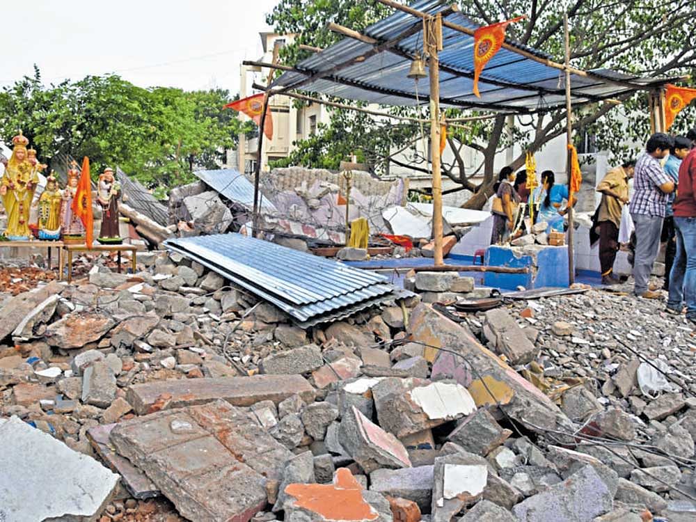 The unauthorised temple and church on Queen's Road Cross, which were demolished by the BBMP on Saturday. DH PHOTO