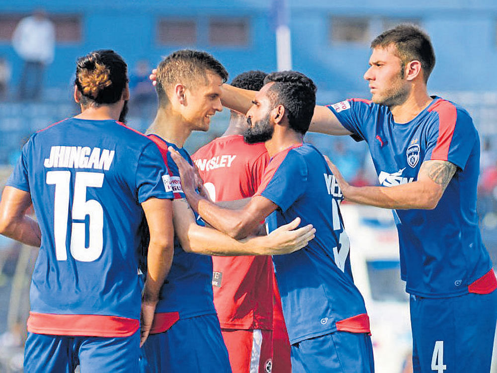 Well done: Bengaluru FC's Cameron Watson (centre) celebrates after scoring against Aizawl FC&#8200;on&#8200;Sunday. BFC&#8200;media