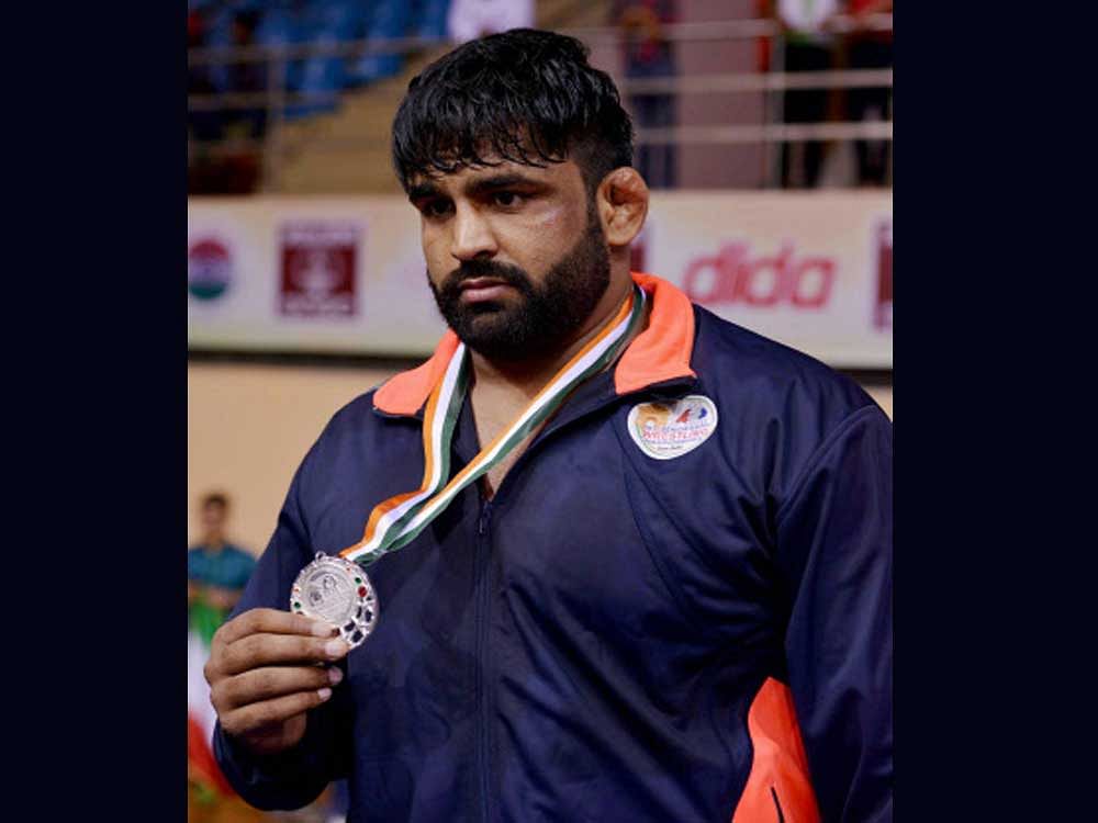 Silver medalist India's wrestler Sumit after 125 kg category event at Asian Wrestling Championship at I G Stadium in New Delhi on Saturday. photo credit: PTI