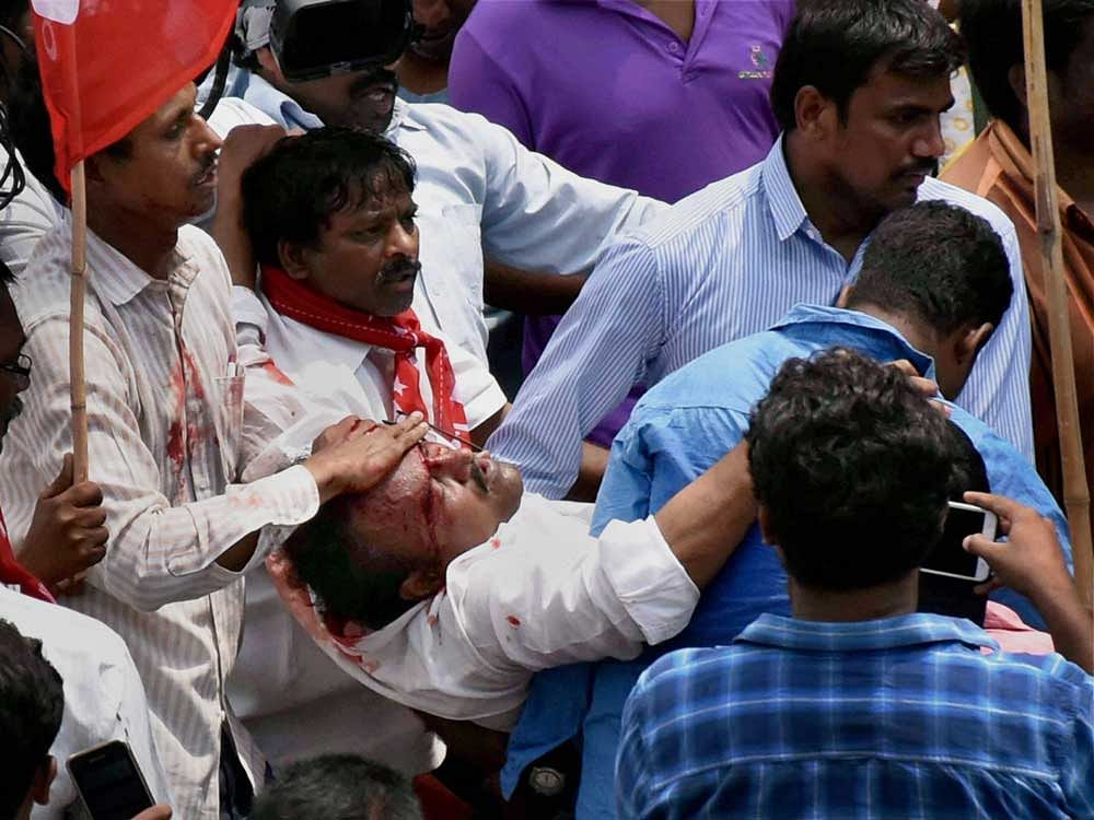 An injured protester being taken away after the police lathi-charge during the Left parties' 'Chalo Indira Park' protest march for the reopening of the Dharna Chowk in Hyderabad on Monday. PTI Photo