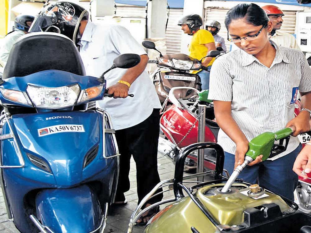 Actual reduction in price will be more after taking into account local VAT. Petrol in Delhi will cost Rs 65.32 a litre from tomorrow as against Rs 68.09 currently. Similarly, a litre of diesel will be priced at Rs 54.90 as compared to Rs 57.35 at present. File photo