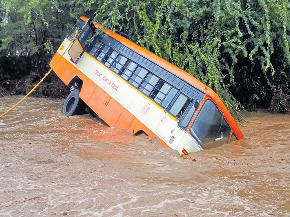 An NWKSRTC bus which fell into an overflowing stream near Lakshmeshwar in Gadag district.