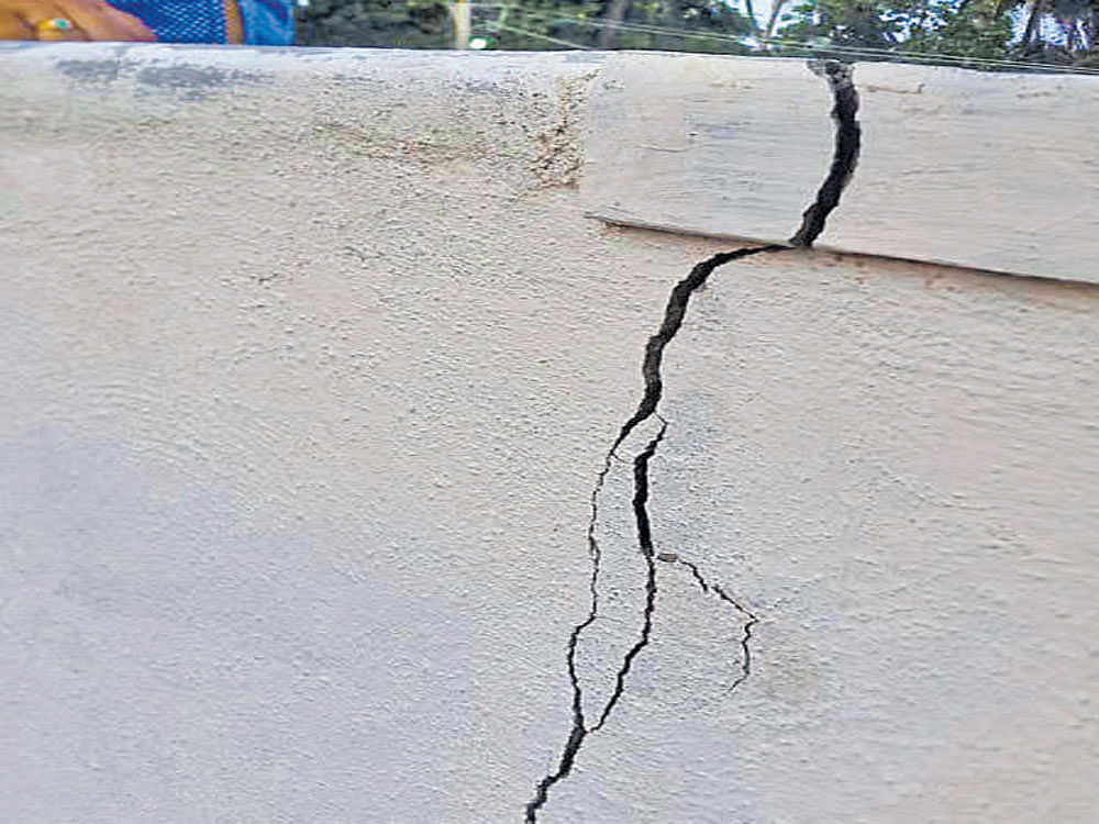 The cracks found on the walls of a few houses at Goravanahalli village near Maddur in Mandya district on Monday.