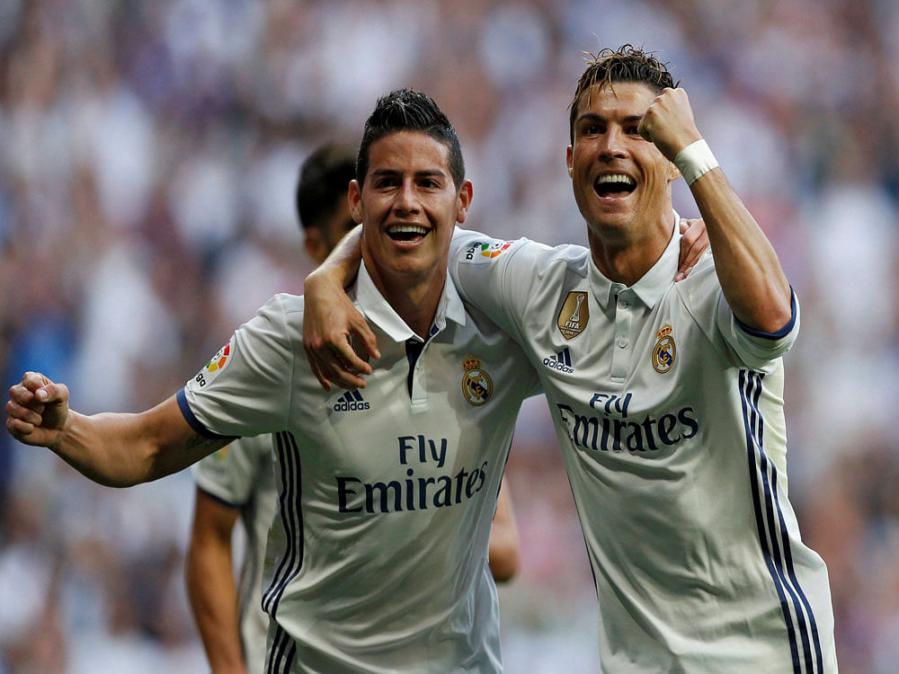 Goal Machine: RealMadrid's Cristiano Ronaldo (right) celebrates his goal with team-mateJames Rodriguez. AFP