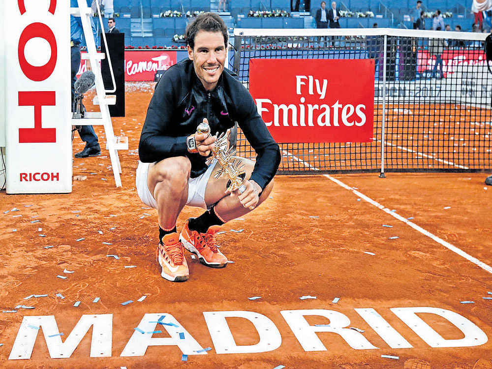 Champion: Spain's Rafa Nadal with the Madrid Open title on&#8200;Sunday. Reuters